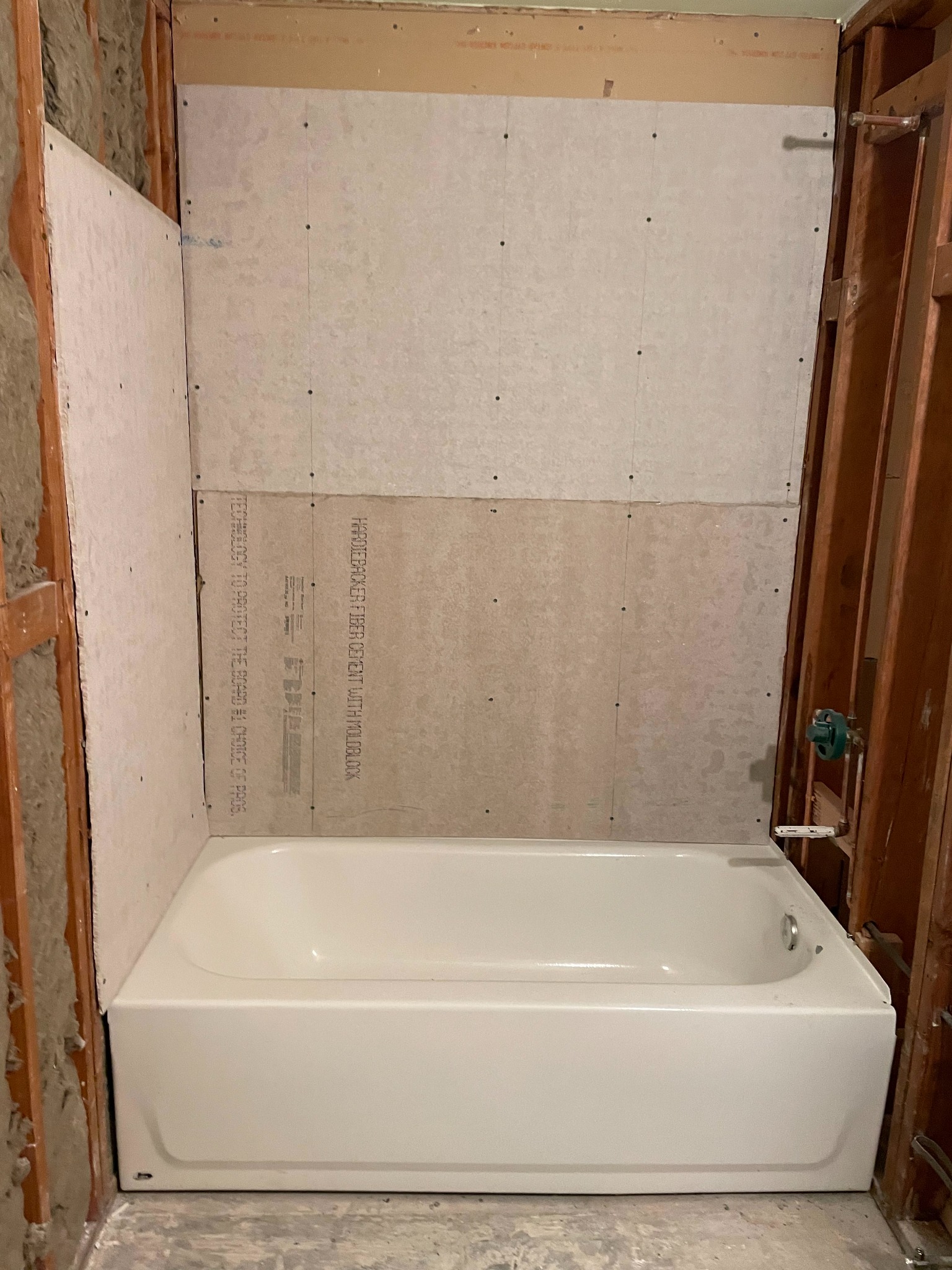 Tub surround backer installed